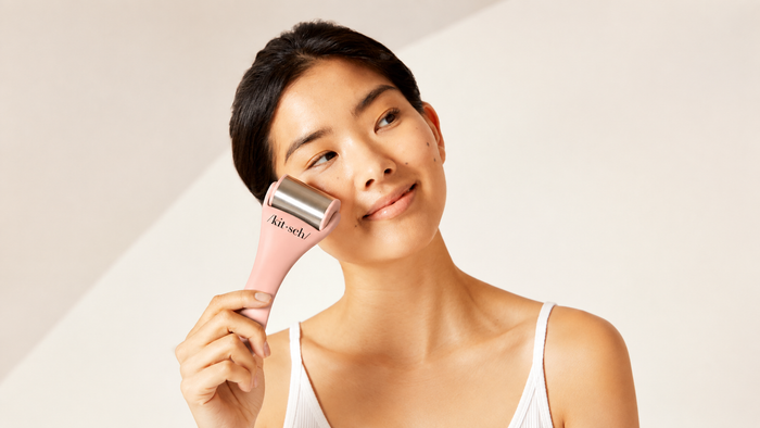 Woman using on her face the Terracotta Ice Roller by Kitsch
