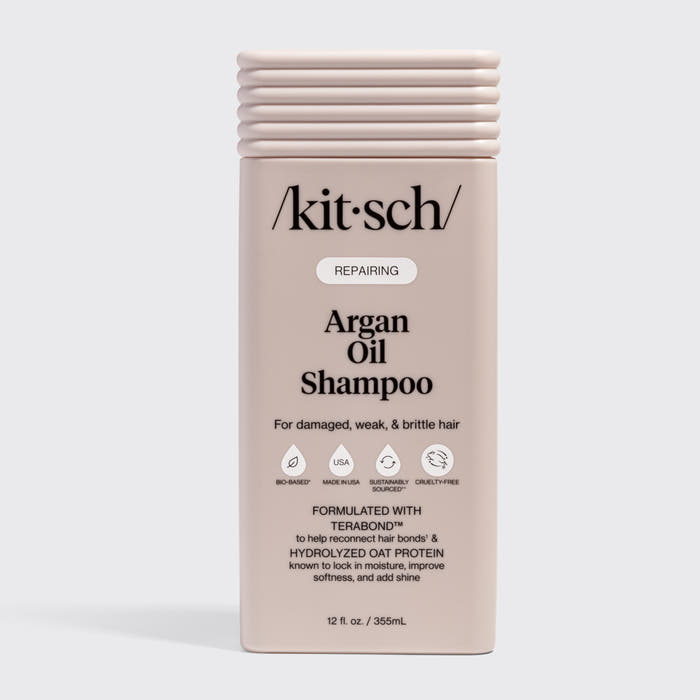 KITSCH Repairing Argan Oil Shampoo 12 fl. oz. — labeled REPAIRING, For damaged, weak, & brittle hair — icons: Bio-Based, Nontoxic, Sustainably Sourced, Cruelty-Free — Formulated with Terabond™ to help reconnect hair bonds & Hydrolyzed Oat Protein to lock in moisture, improve softness, and add shine