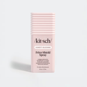 KITSCH Humidity Blocking Frizz Shield Spray — hero standalone bottle shot on light gray background — Humidity-Blocking | Frizz Shield Spray — Formulated with GLASSPLEX™ — For sleek, shiny blowouts — 6 fl. oz. / 177mL — Locks out moisture and prevents frizz, adds intense shine & smooth glass-like finish