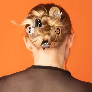 Halloween Mini Claw Clips 6pc Set styled in a braided updo with skull, black cat, and pumpkin mini claw clips.