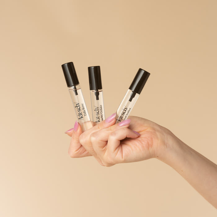 Kitsch Coastal Hair Perfume Trio Set - lifestyle model shot, all 3 bottles in hand