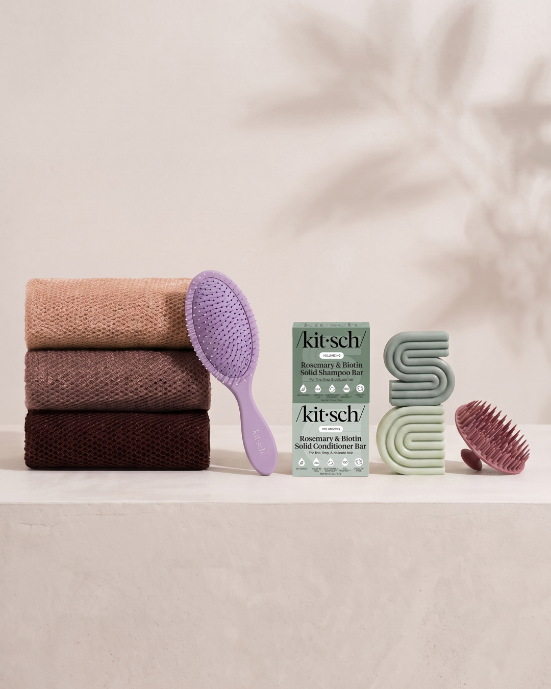 Kitsch Spring Welcome Kit Rosemary & Biotin shown as a full bundle with the Volumizing Rosemary & Biotin Shampoo and Conditioner Bars, Soft Violet Wet/Dry Brush, Terracotta Scalp Exfoliator and Rosewood African Net Sponge on a soft neutral background