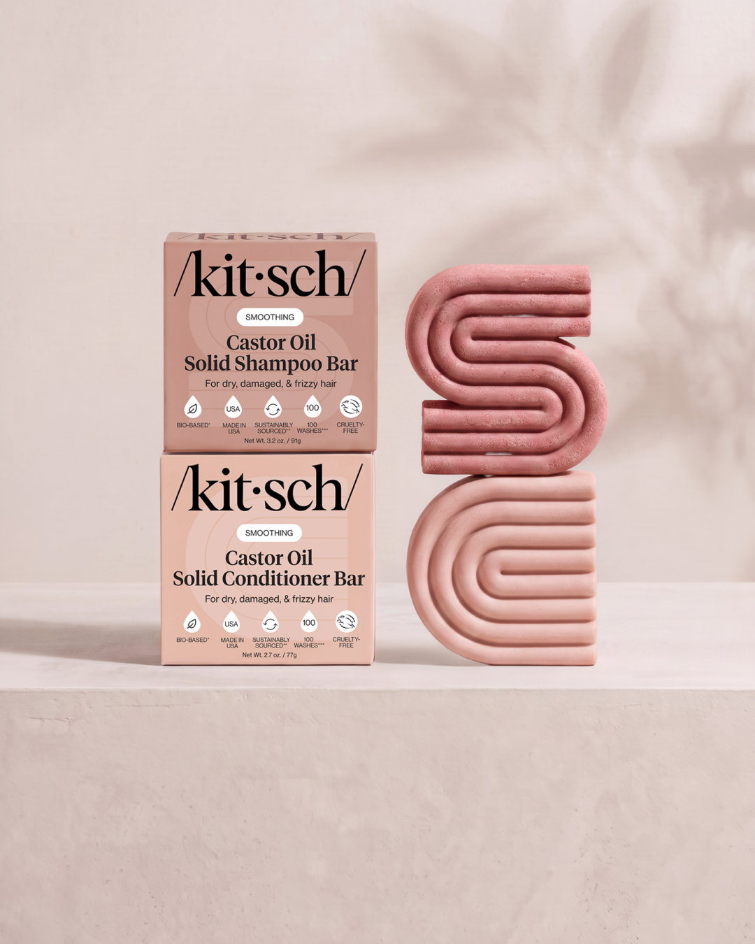 Kitsch Nourishing Castor Oil Solid Shampoo and Conditioner Bars shown side by side with retail packaging – for dry, damaged and frizzy hair